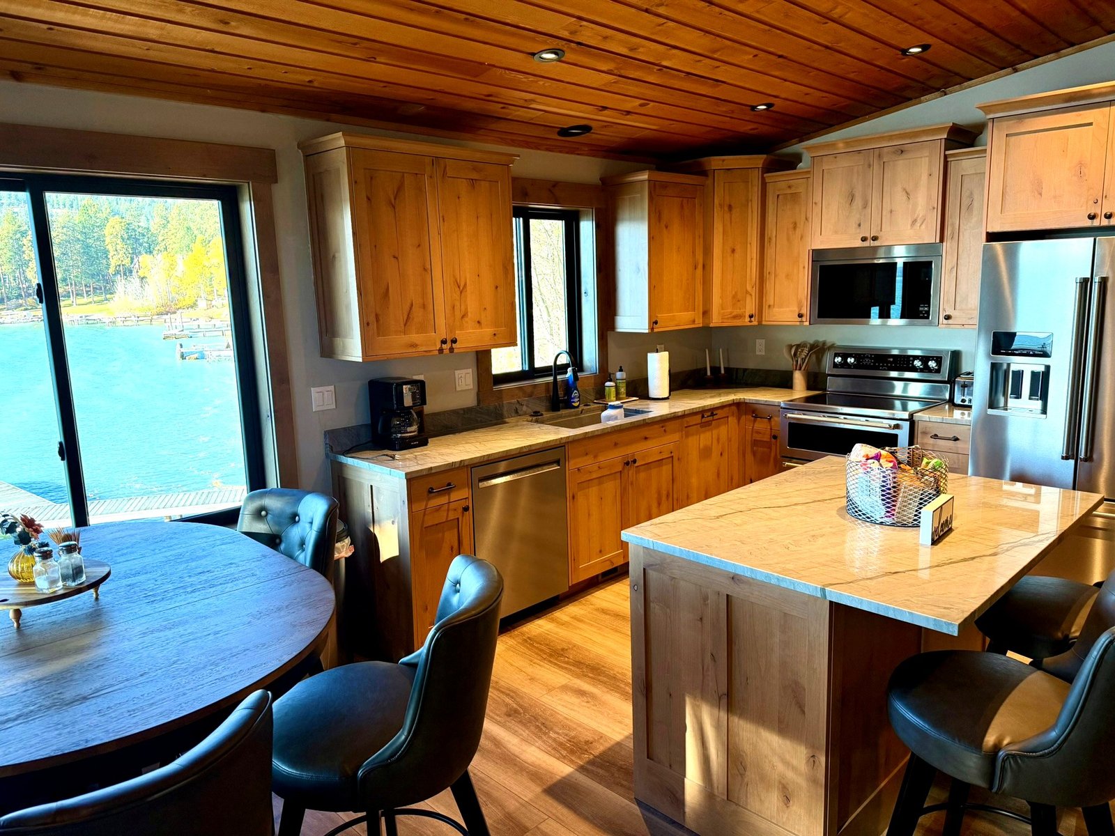 Open kitchen and dining area in Eagle's Bluff Lakeside House on Flathead Lake
