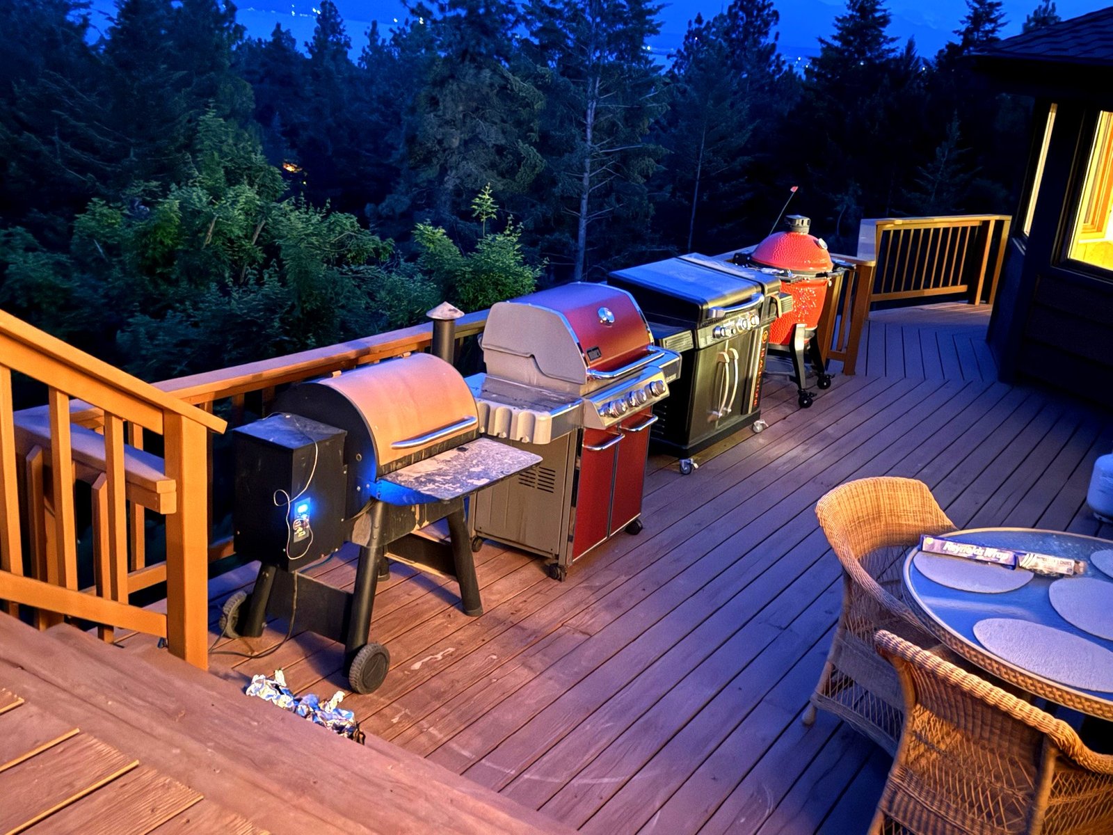 Back deck with built-in grills and Flathead Lake views at Eagle's Bluff estate