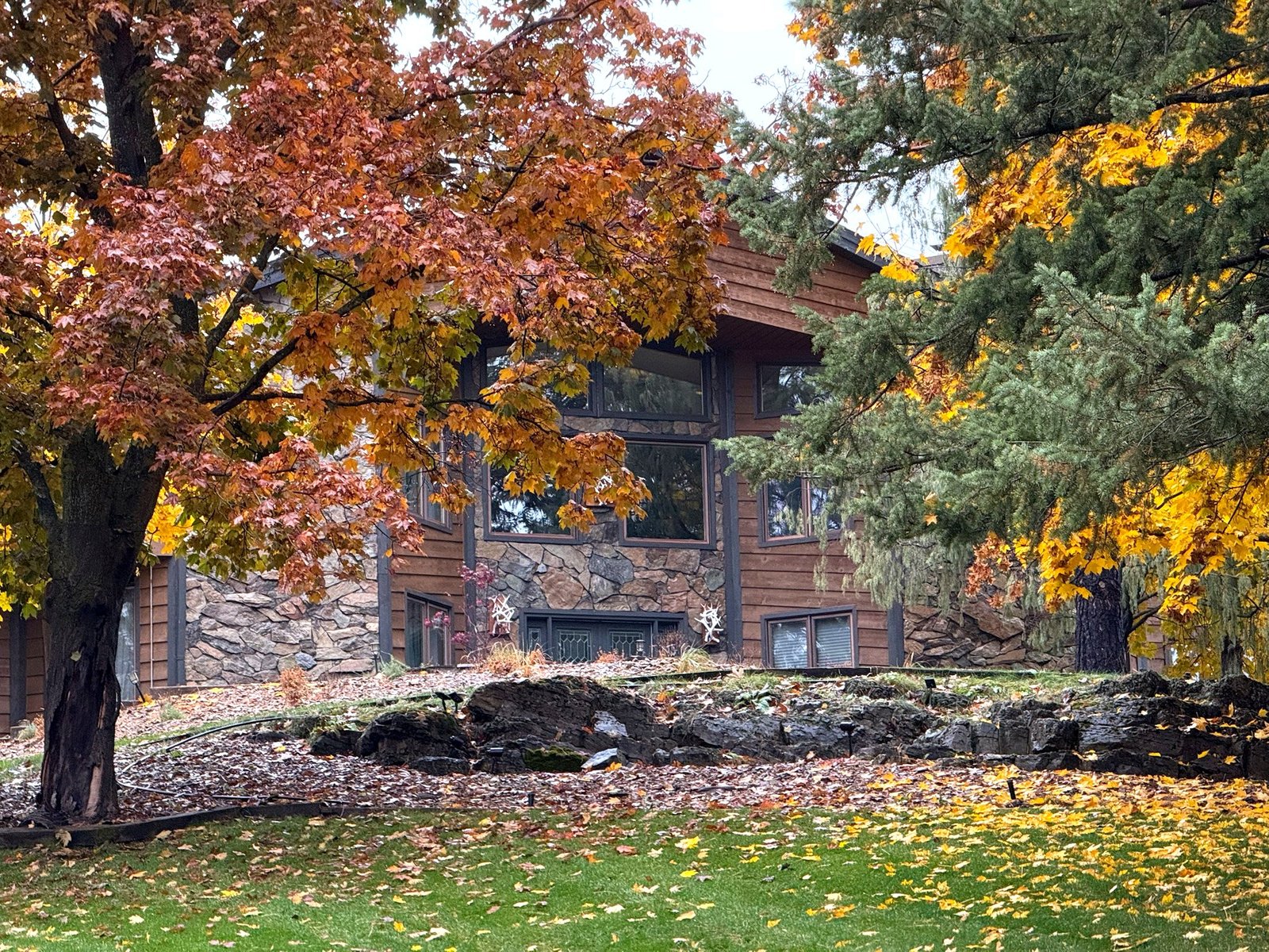 Eagle's Bluff Main House surrounded by fall colors near Polson, Montana