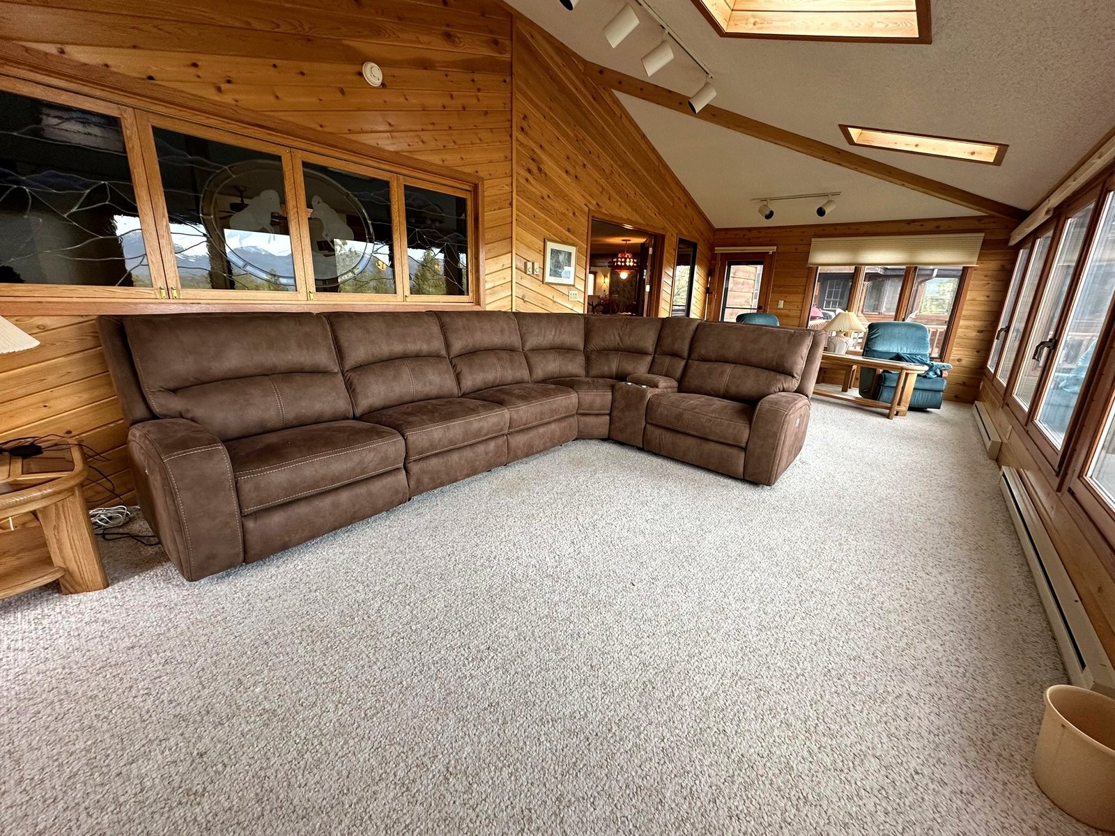 Sun room with natural light and mountain views at Eagle's Bluff estate
