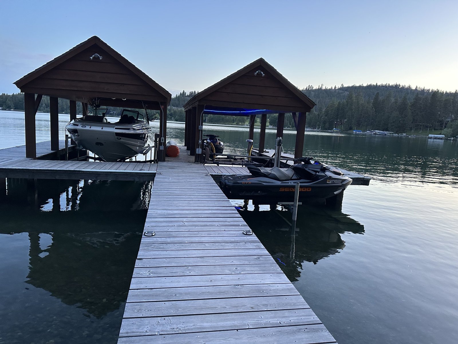 Covered boat house and dock at Eagle's Bluff estate on Flathead Lake