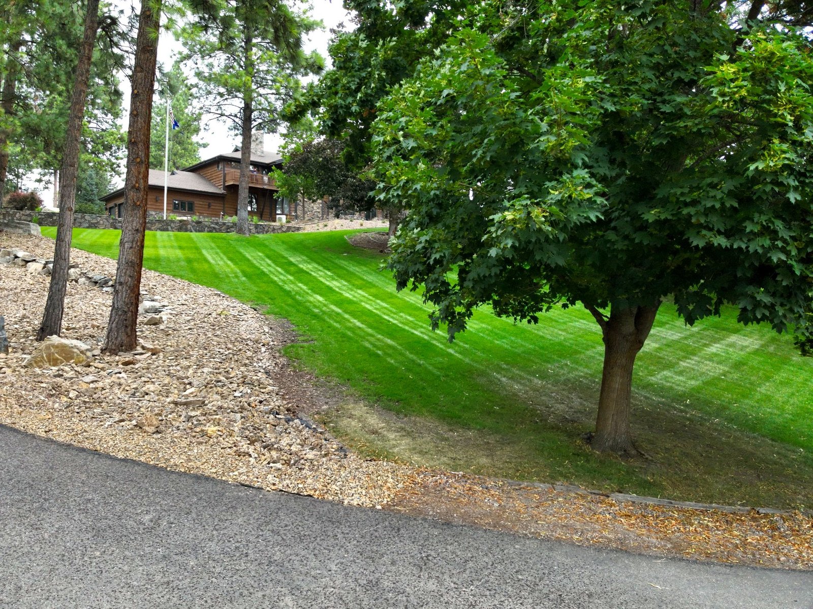 Panoramic aerial of Eagle's Bluff luxury estate overlooking Flathead Lake