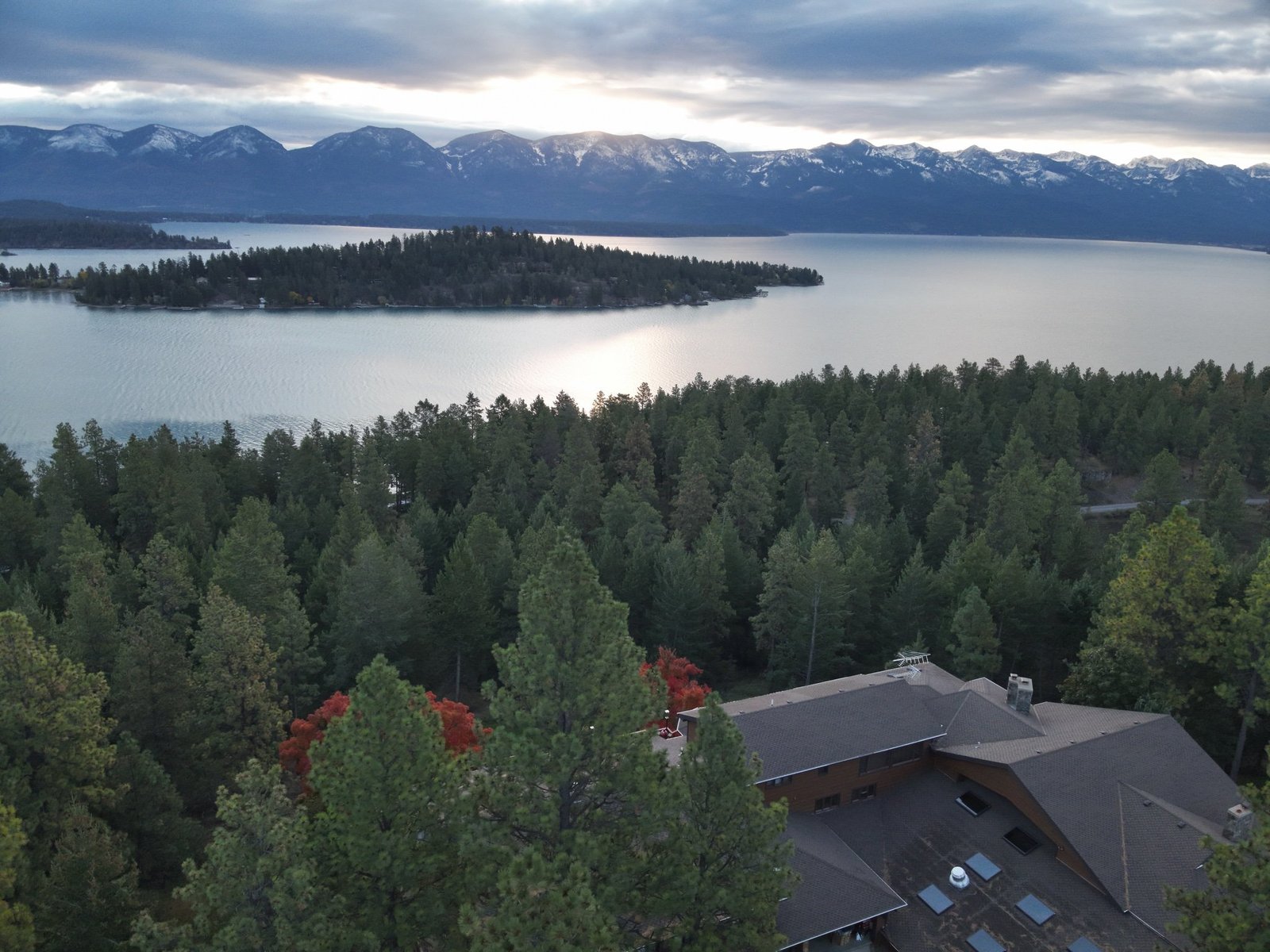 Wide aerial of Eagle's Bluff private peninsula and Flathead Lake near Polson, Montana